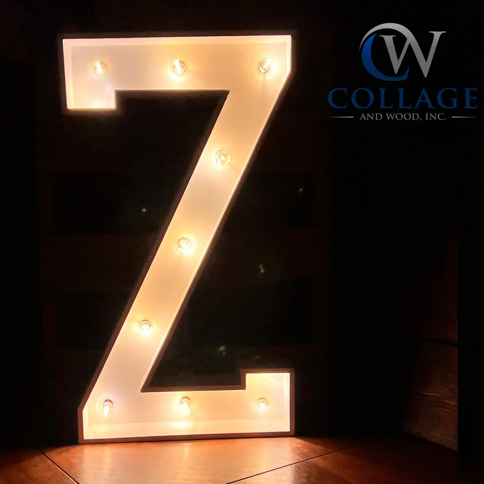 Zealous wooden marquee letter Z, standing tall at 3 feet, in a polished white finish, sparking to life with dazzling LED lights.