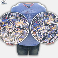 Person holding two large circular photo collages in the shape of volleyballs from CollageandWood.com