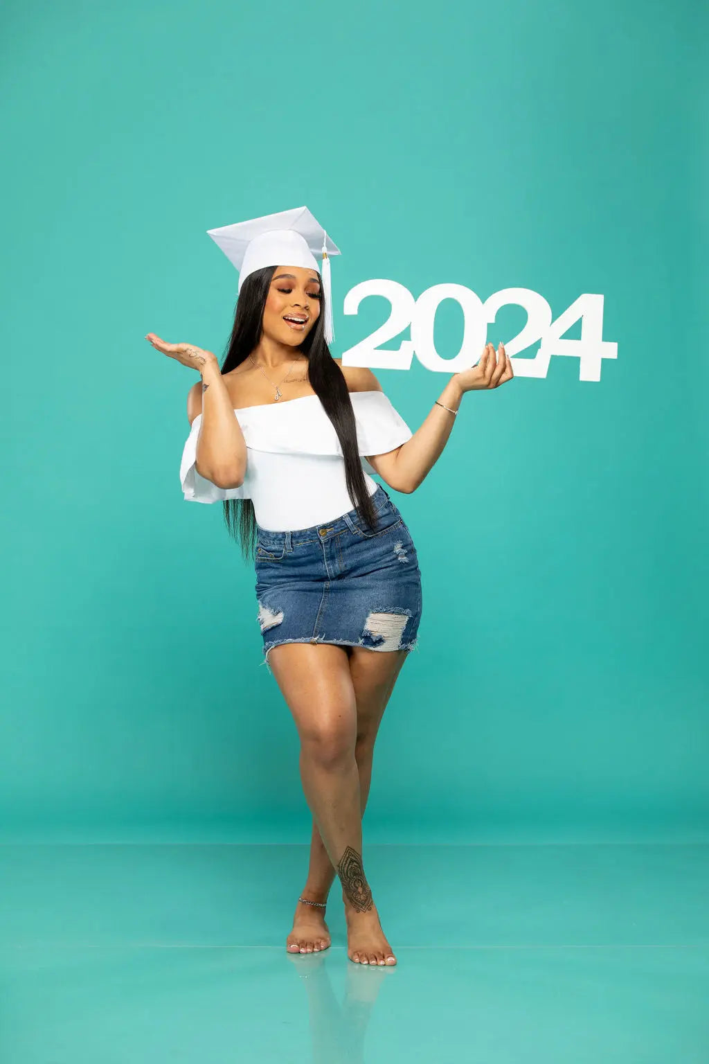 2024 picture prop held by beautiful graduate!