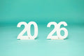 2026' photo prop from collageandwood.com on a teal background.