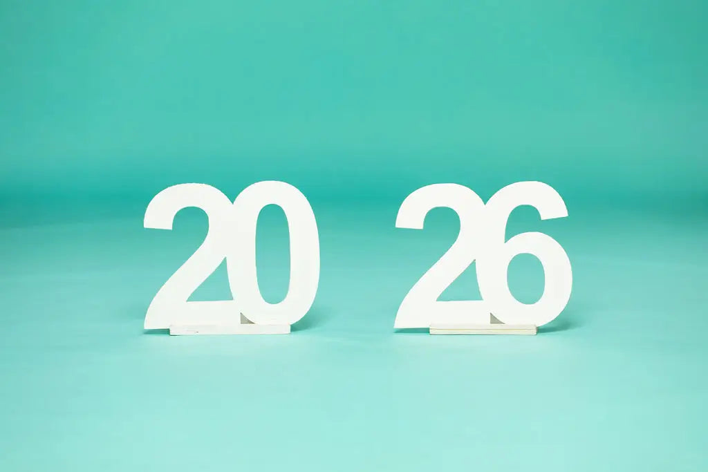 2026' photo prop from collageandwood.com on a teal background.