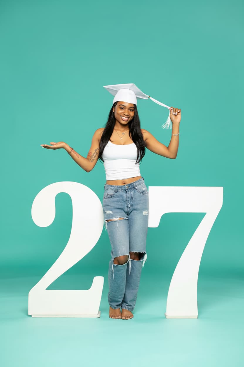 Person in graduation attire standing next to large number '27' on a teal background