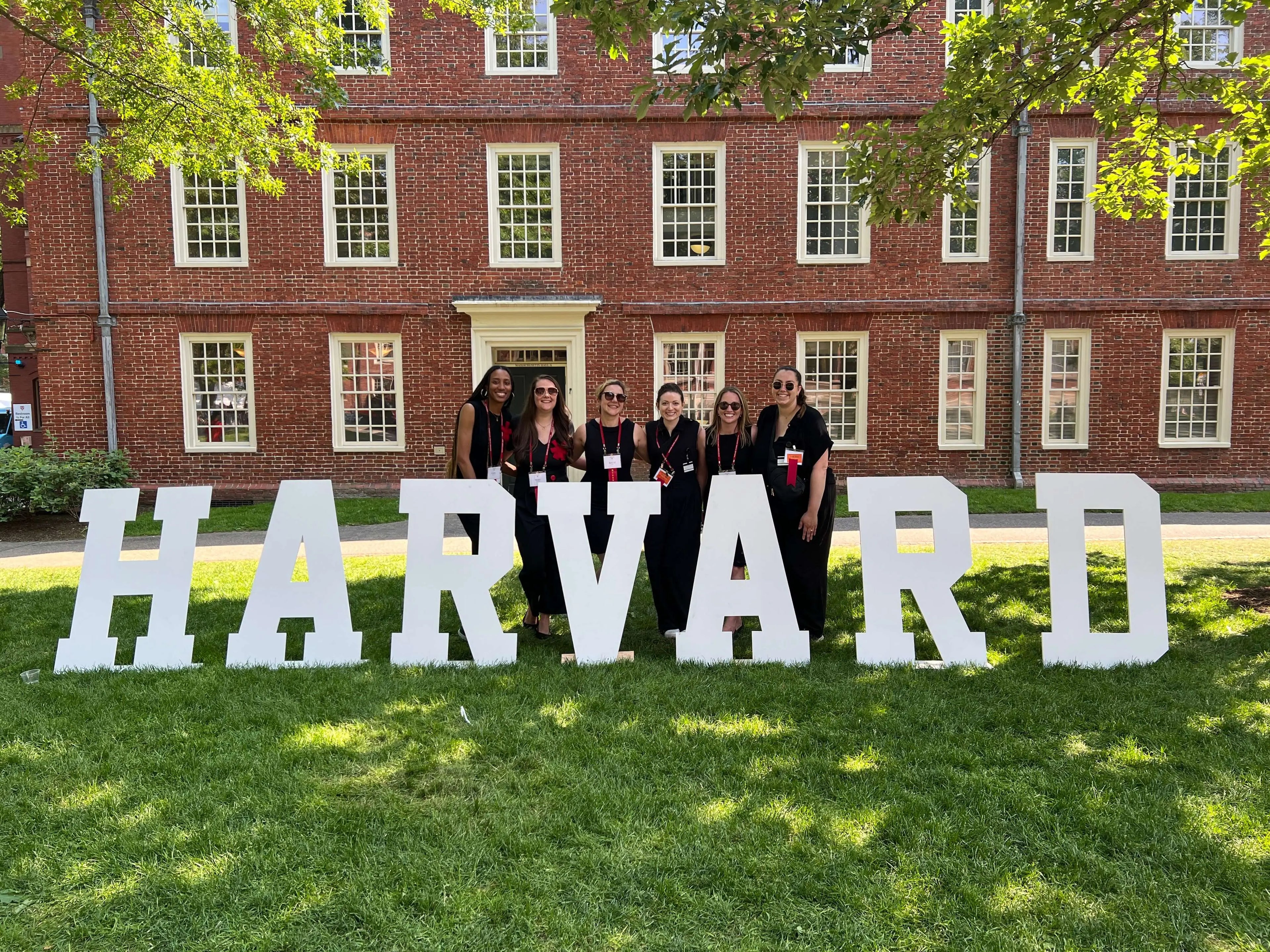 giant wooden letters from Collage and Wood on display for a harvard alumni event.