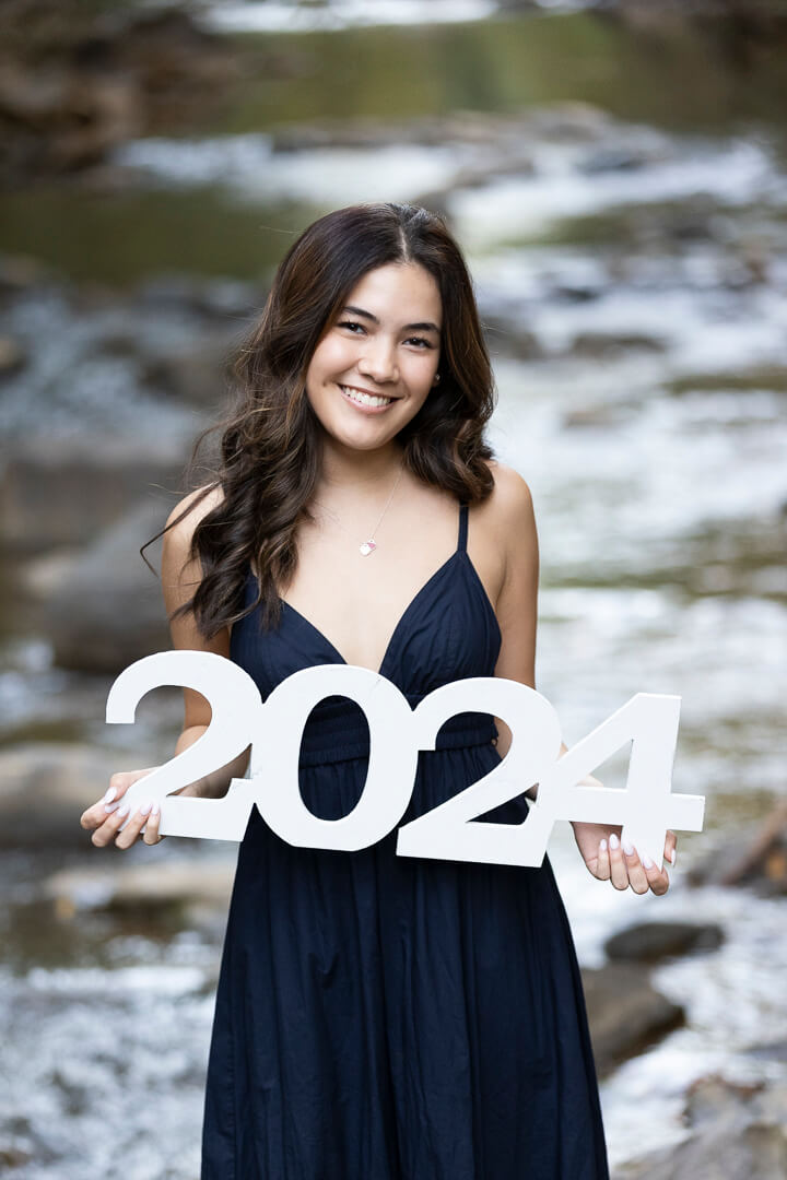 outdoor senior photo shoot with wooden white 2024