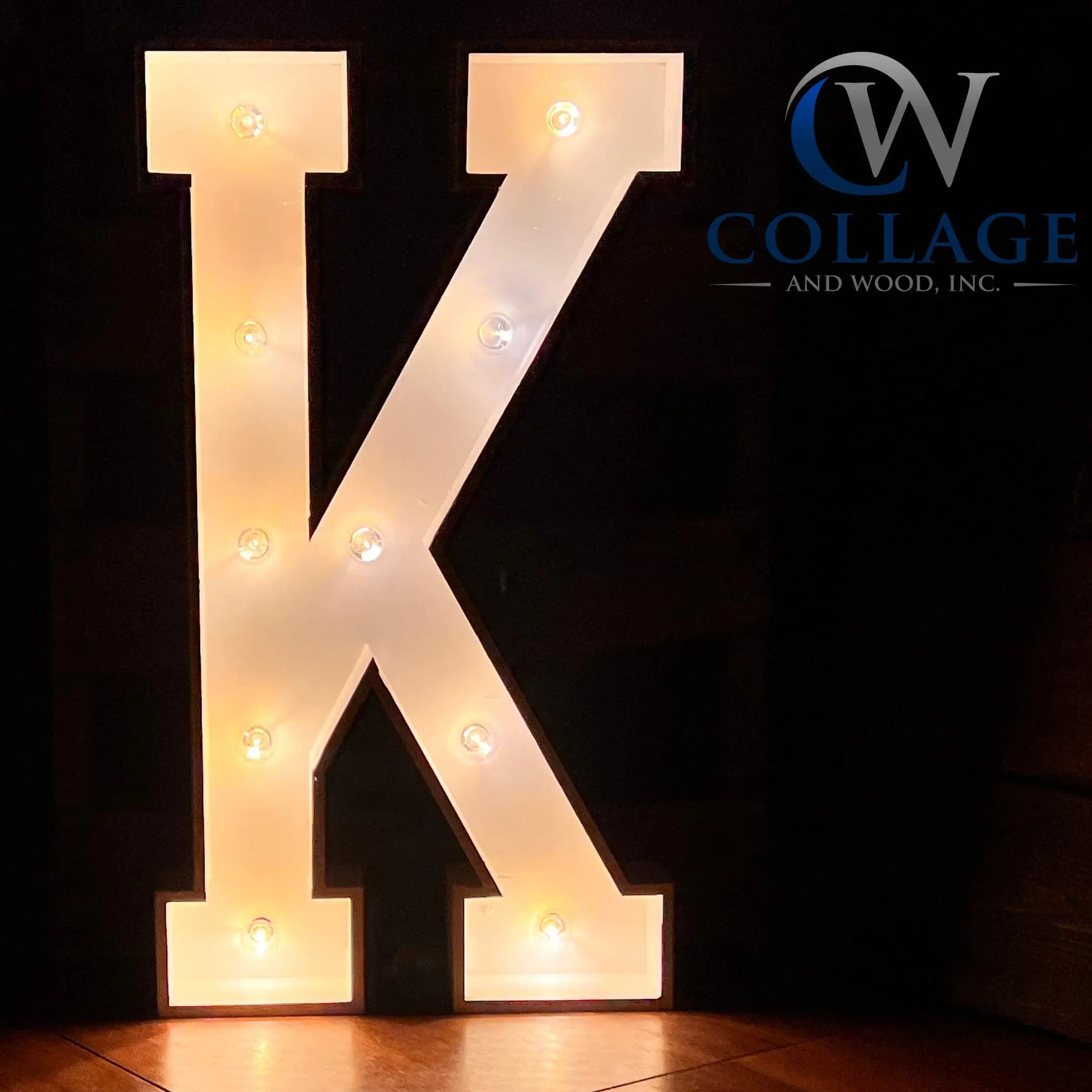 Kingly 3-foot tall wooden marquee letter K, classically painted in white, sparked to life by vibrant battery-powered LED lights.