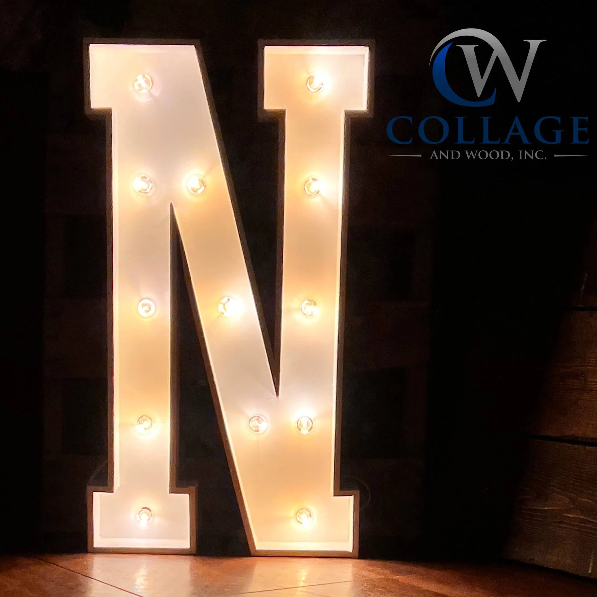 Noble wooden marquee letter N, standing tall at 3 feet, in a polished white finish, glowing with radiant LED lights.