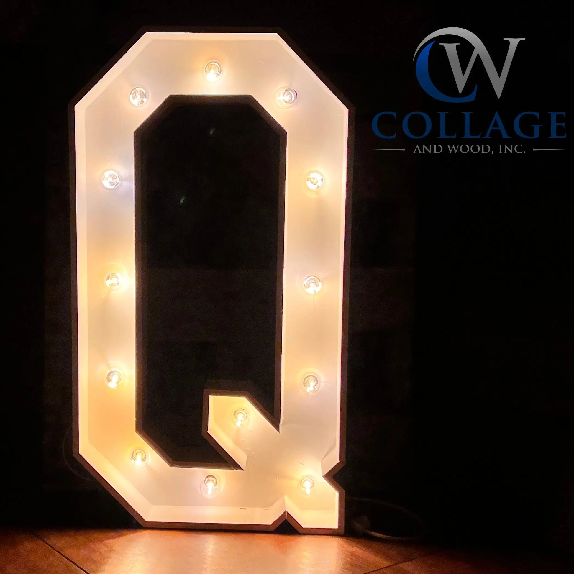 Quintessential 3-foot tall wooden marquee letter Q, classically painted in white, adorned with gleaming battery-powered LED lights