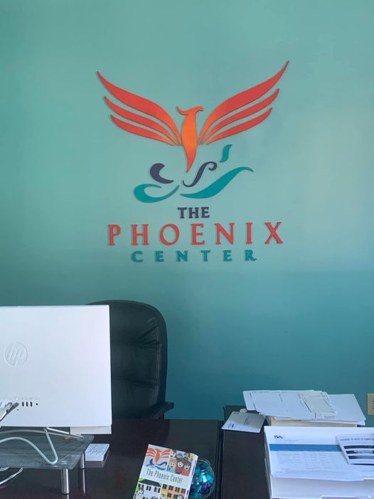 Custom wooden Logo sign: The Phoenix Center.