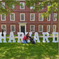 giant wooden letters from Collage and Wood on display for a harvard alumni event.