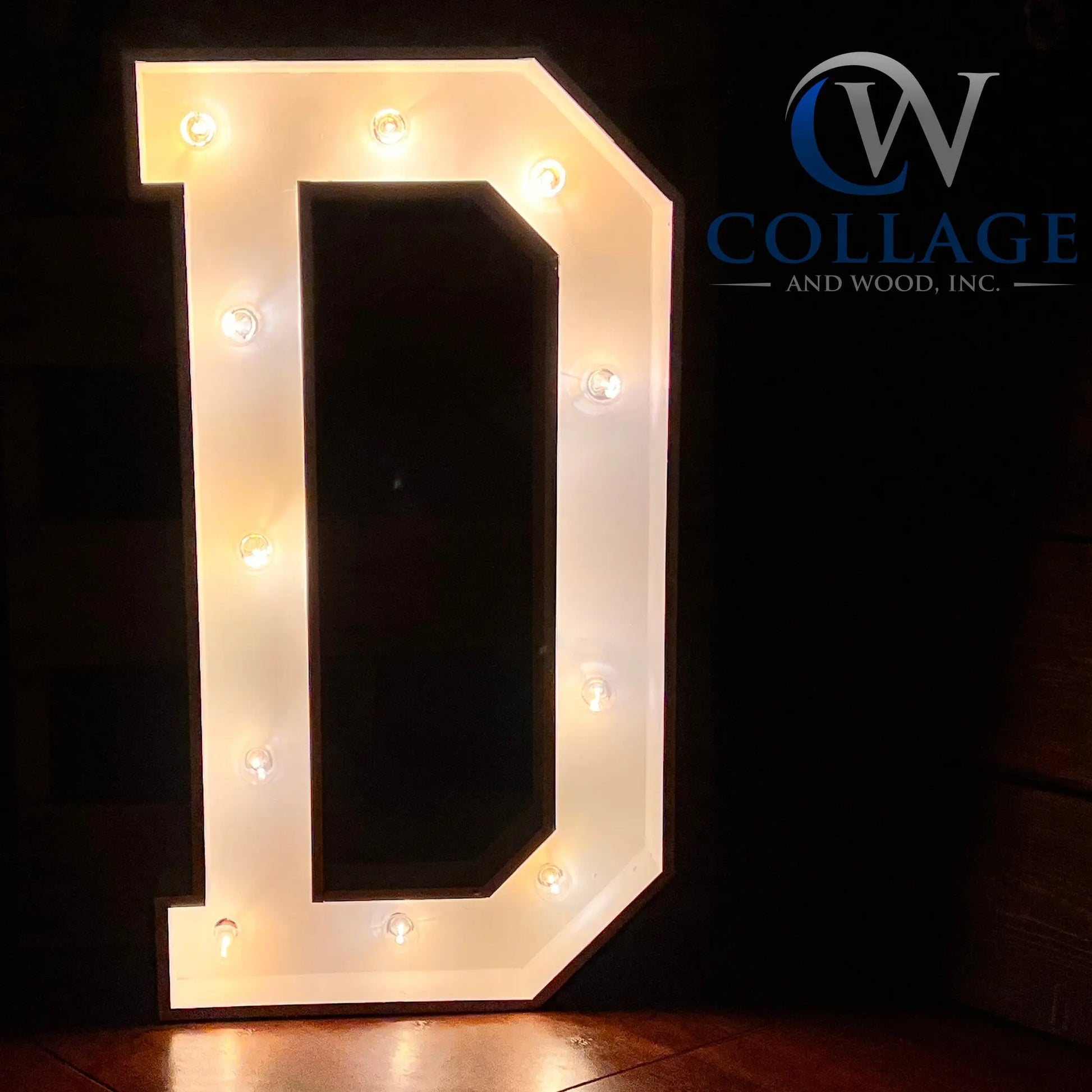 D - Dazzling wooden marquee letter D, stretching 3 feet tall, painted in a clean white hue, highlighted by radiant LED lights.