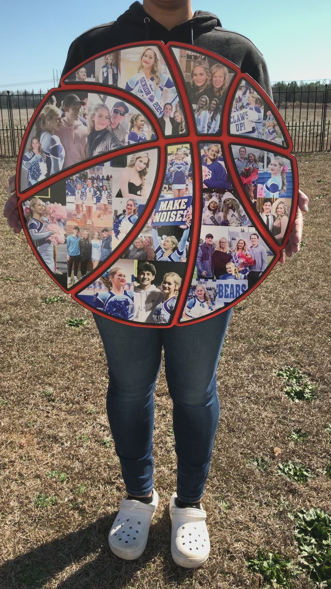 Crystal holds a 24 inch basketball collage in this video. It's covered with photos.