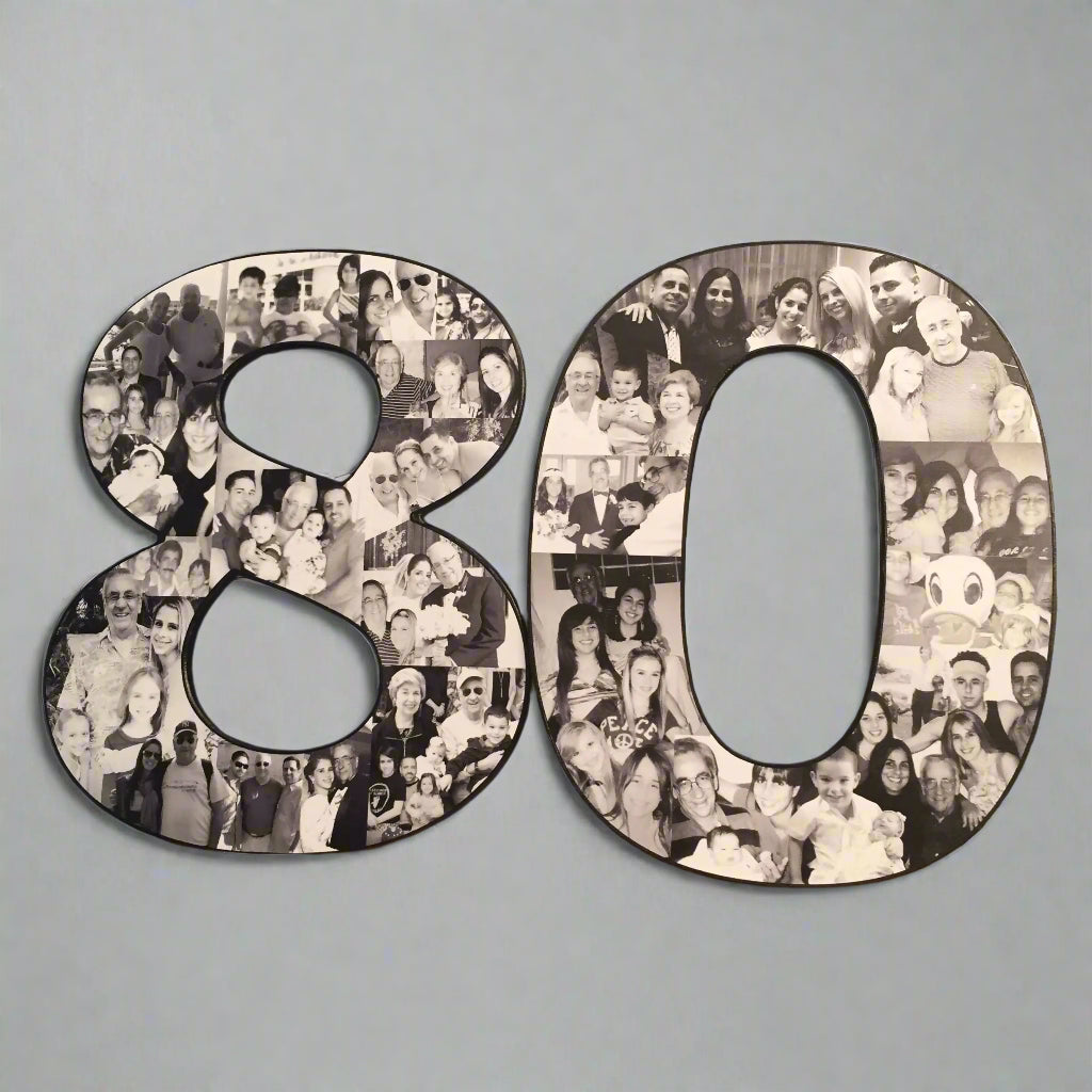 A black-and-white photo collage shaped like the number '80' sits on a wooden surface against a light wall, capturing treasured moments from a loved one’s life in a timeless display.