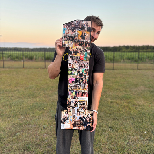 Jon Waddell of CollageandWood.com holds a tall, number-shaped photo collage filled with pictures of beach volleyball players, indoor volleyball players, and teammates wearing volleyball shoes, standing on a grassy field at sunset.”

This keeps the description accurate to the image while naturally weaving in the keywords: beach volleyball players, volleyball players, volleyball shoes, and indoor volleyball players.