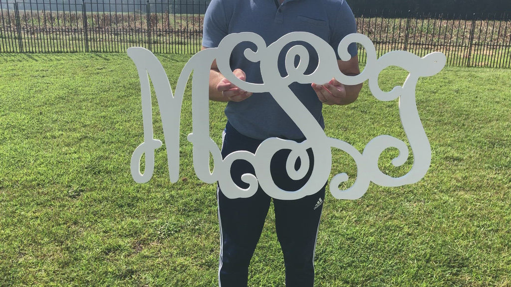 video of giant 3 letter monogram (shown in white) MSJ